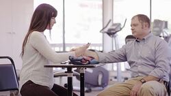 Female occcupational therapist working with an adult patient Stock Footage