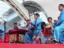 MS Folk artists of chinese opera troupe playing accompaniment with music instrument at temple fair to celebrate chinese spring festival  AUDIO  / xi'an, shaanxi, china Stock Footage