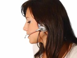 NTSC - Customer support phone operator smiling and speaking Stock Footage