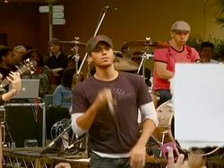 Enrique Iglesias Promotes Release of 'Insomniac' with Performance and Signing Stock Footage