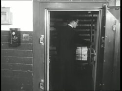 A man enters a vault in Fort Knox and looks at a gold bar. News Clip