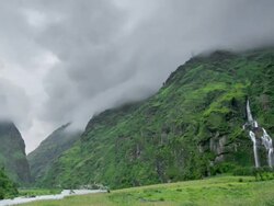 T/L low cloud forming over Tal Valley Waterfall, Himalayas Stock Footage