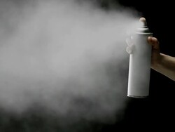 Spraying on black background Stock Footage