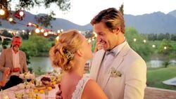 Bride and groom hugging and talking at wedding reception Stock Footage
