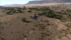 A helicopter flies over a game reserve in South Africa. Stock Footage