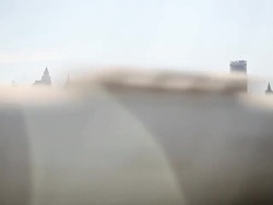 crossing a bridge with a skyline in the background Stock Footage