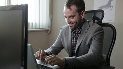 Happy Businessman Using Computer Stock Footage