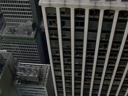 High angle pan up skyscrapers to view of Chrysler Building / New York City Stock Footage