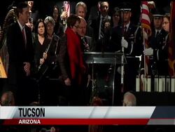 Rep. Gabrielle Giffords led a huge crowd in the Pledge of Allegiance at a candlelight vigil in Tucson, Arizona on Sunday.  The event was held to remember a shooting there one year ago that killed six people, and wounded many, including Giffords. News Clip