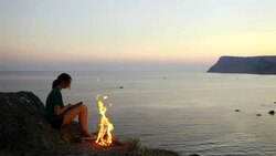 Girl near campfire Stock Footage
