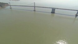 Traffic crosses Bay Bridge over San Francisco Bay. Stock Footage