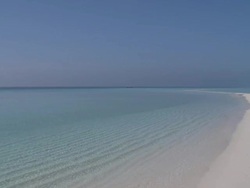 White beach and gentle waves at Landaa Giraavaru, Baa Atoll, The Maldives Stock Footage