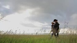 Female ranchers walking in remote rural field Stock Footage