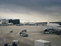 Airplanes parked at large airport Stock Footage