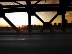 Man runs across bridge Stock Footage