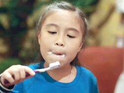 Little girl brushing teeth Stock Footage