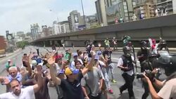 CLEAN : Opposition leader Capriles hit with tear gas in Caracas protest News Clip