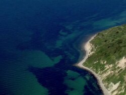  AERIAL MS PAN View of light house at island near ocean / Prerow+Kirr, Mecklenburg-Vorpommern, Germany Stock Footage