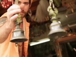 Sage ringing bells at market, Rishikesh, Uttarakhand, India Stock Footage