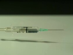 High speed Syringe falls on to surface, bouncing Stock Footage