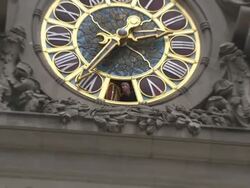 A man peers out of a roman numeral on a large clock at Grand Central Station. Stock Footage