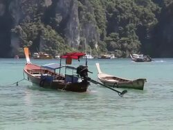 Water taxi floating on the sea (Phiphi Island, Krabi, Thailand). Stock Footage
