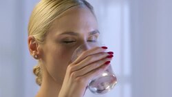 Woman drinking water Stock Footage