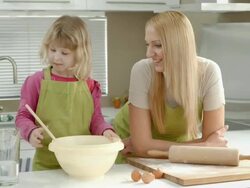 HD DOLLY: Teaching Little Girl How To Cook Stock Footage