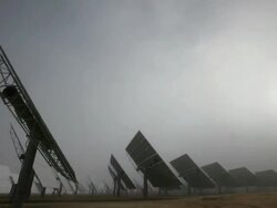 Long Shot static , Solar panels rotate in a large array. / California Stock Footage