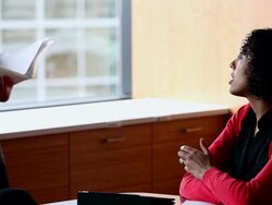 MS PAN TU TD R/F Three coworkers in discussion in conference room/Washington, USA Stock Footage