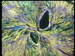 Rotate and zoom in to multi coloured yellow, purple and blue crystal filaments Stock Footage