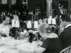 B/W 1934 women using sewing machines in WPA garment factory / documentary Stock Footage