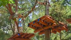 boy in the municipal adventure park Stock Footage