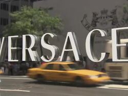 CU, Versace sign on window display reflecting traffic on street, New York City, New York, USA Stock Footage