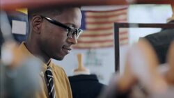 Shop employee types quickly on tablet while taking stock of clothing store Stock Footage