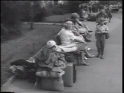B/W 1961 East German refugees sitting on bench outdoors / beginning of Berlin Wall / West Germany Stock Footage
