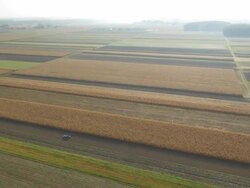 AERIAL Tractor Sowing One Of The Fields Stock Footage