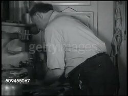 1935: HOME FROM WORK: Mrs. Perkins setting table in dining room, two male teen sons in shirt & tie reading, Fred Perkins entering kitchen, washing hands in hand sink, explaining to wife must pay NRA fine or go to jail, chooses to fight. Instructional Video