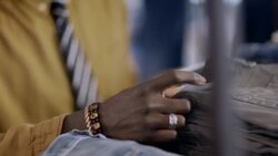 Modern clothing store employee works on tablet and checks price tags of stock Stock Footage