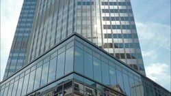 Nearby buildings reflect in the Eurotower. Stock Footage