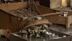 A magnet lifts scrap metal from a steel yard. Stock Footage