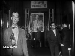 1952: KEFAUVER CAMPAIGN HEADQUARTERS: Journalist Frank Bourgholtzer (1919-2010) standing in Raleigh Hotel (2nd floor) suite w/ microphone, SOT talking about headquarters, ZI MS Senator Kefauver talking w/ woman at desk under HUGE portrait of himself. Instructional Video