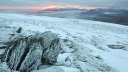 Mist over the Lake District mountains at dusk from the summit of Red Screes, Lake District National Park, Cumbria, UK Stock Footage