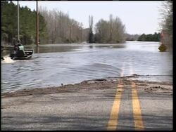 River floods low-lying areas as effects of last week's storms continue Instructional Video