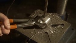 Mechanic drilling a metal ring Stock Footage