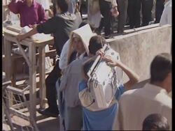 IRAQ : SUPPORTERS OF SADDAM HUSSEIN MARCH IN THE STREETS News Clip