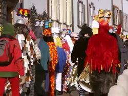 MS Shot of people with mask and dressing up celebrating Basler Fasnacht (Basel Carnival) on street / Basel, Switzerland Stock Footage