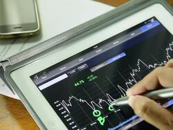 Businessman using Tablet analysis stock data. Stock Footage
