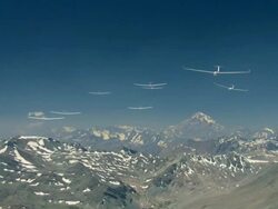 2010 AERIAL Group of gliders flying high over rocky, snowcapped mountains / Santiago de Chile, Gran Santiago, Chile Stock Footage