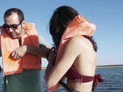 MS Couple on boat helping each other put on life jackets / Charleston, South Carolina, USA Stock Footage